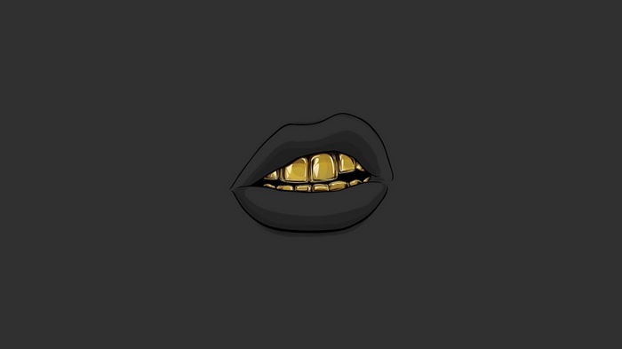 Black lips with gold teeth