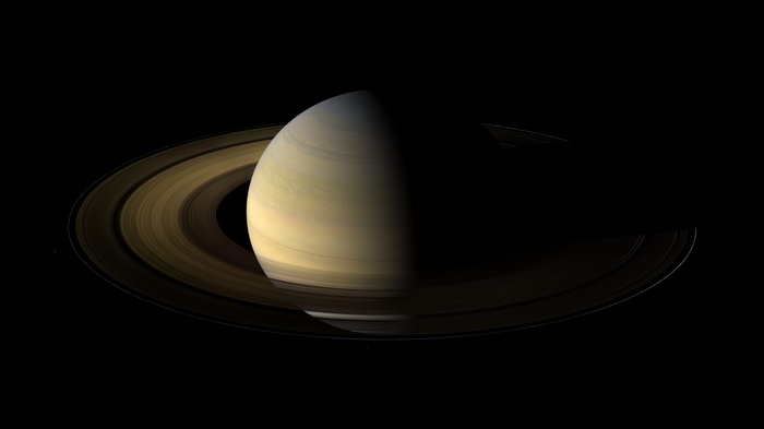 Saturn and its rings against a black background