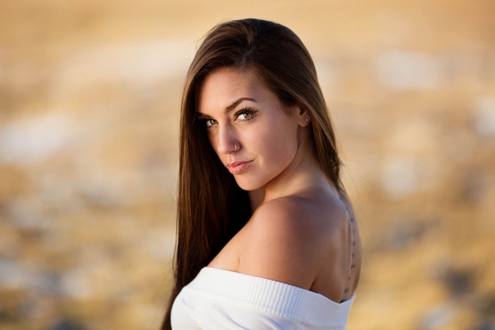 Woman with long hair and tattoo