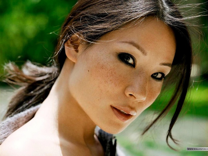 Lucy Liu with freckles and dark eye makeup