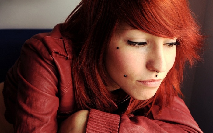Redhead woman with facial piercings