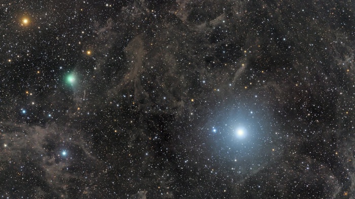 Comet and stars in the night sky