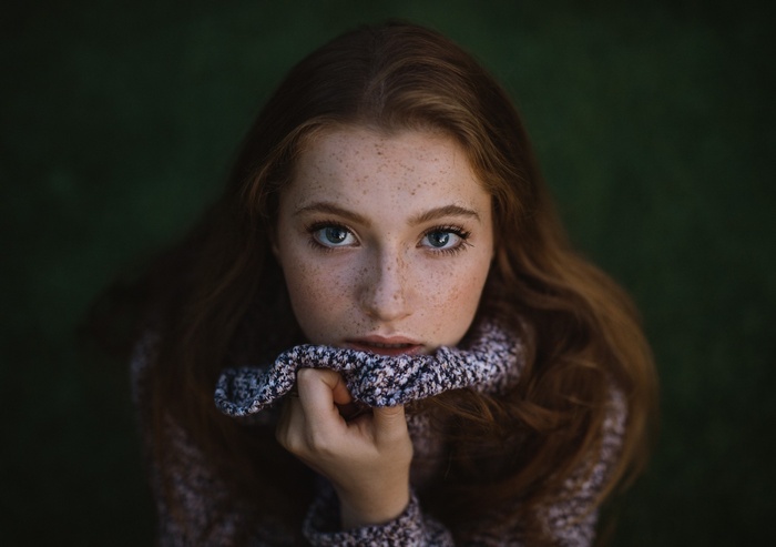 Portrait of a young woman with freckles