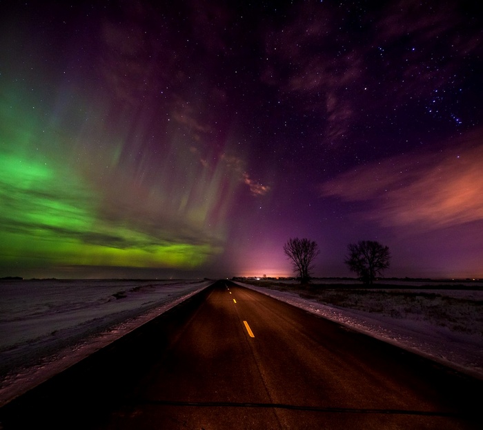 Aurora Borealis over a road at night
