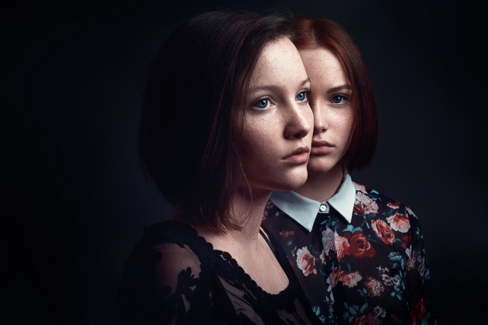 Two young women with freckles posing