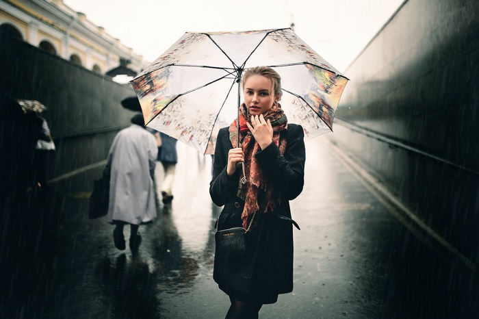 Woman holding an umbrella in the rain