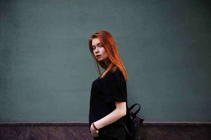 Anya Altotskaya portrait against a teal wall