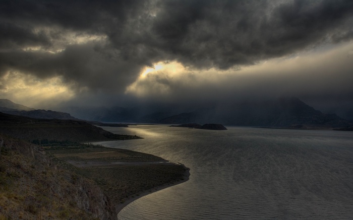 Stormy sky over a lake and mountains in Chile
