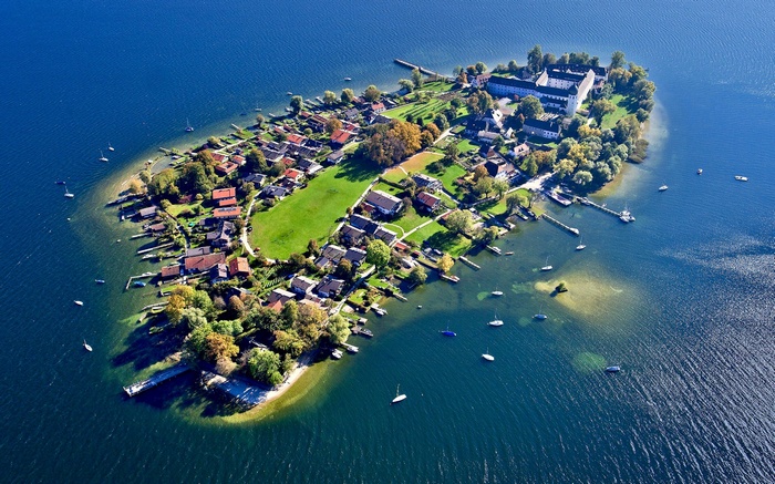 Frauenchiemsee island with houses and boats in Germany