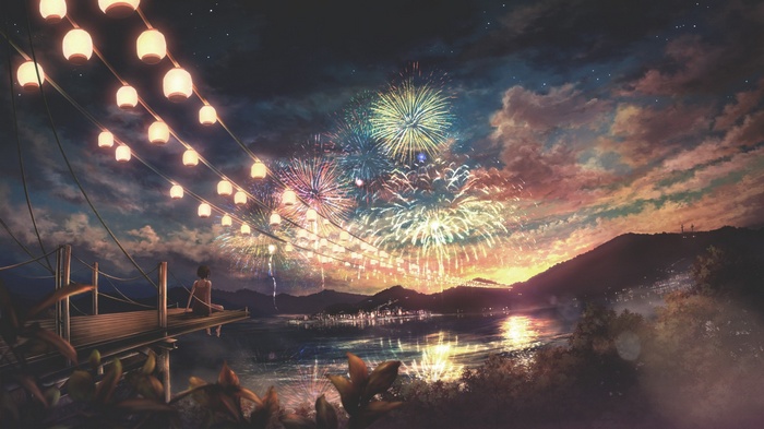 Fireworks display over a town at night