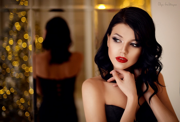 Olga Galitsyna in a black dress with red lipstick