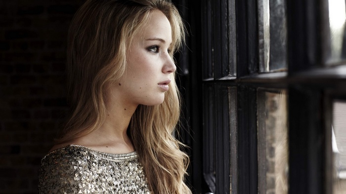 Jennifer Lawrence looking out a window