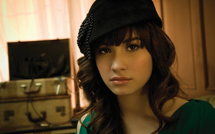 Demi Lovato wearing a black hat