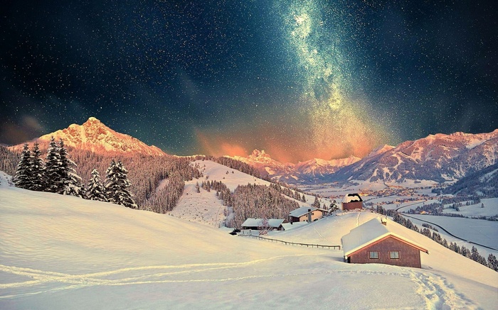 Snowy mountain landscape under the Milky Way