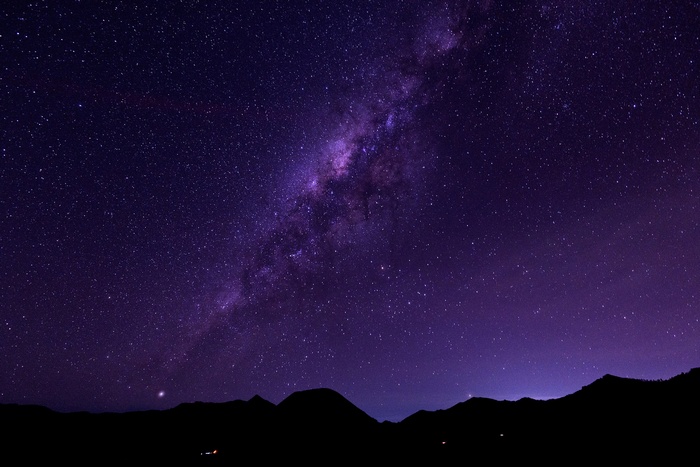 Milky Way galaxy over silhouetted mountains at night