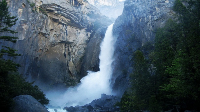 Waterfall cascading down a rocky cliff face
