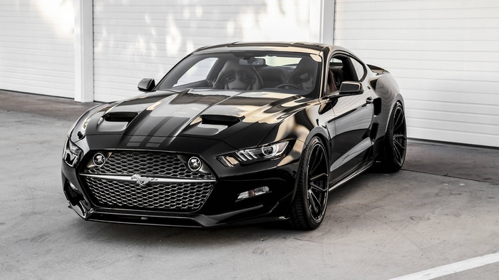 Black Ford Mustang GT with racing stripes
