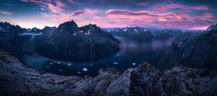 Greenland Fjord with Mountains and Icebergs at Sunset