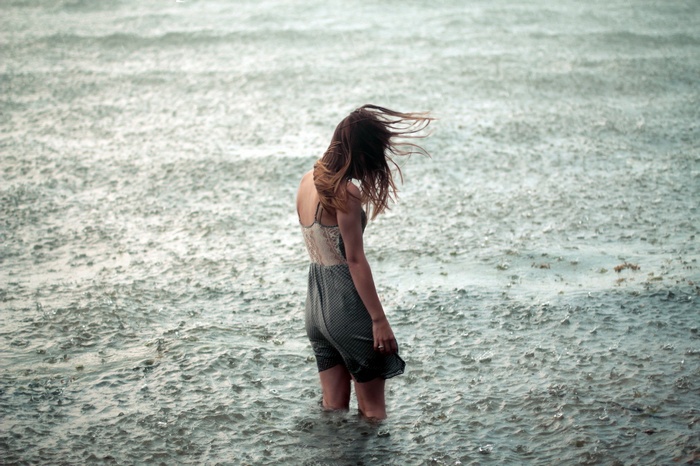 Woman standing in the rain