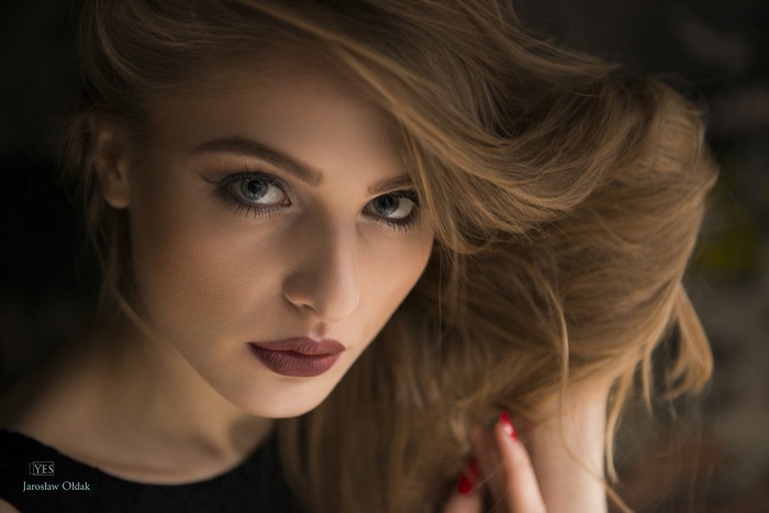Portrait of a woman with auburn hair and blue eyes