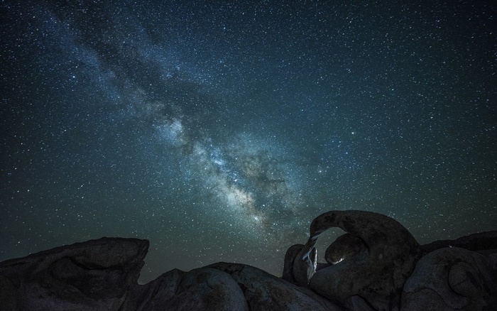 Milky Way over rock formations at night