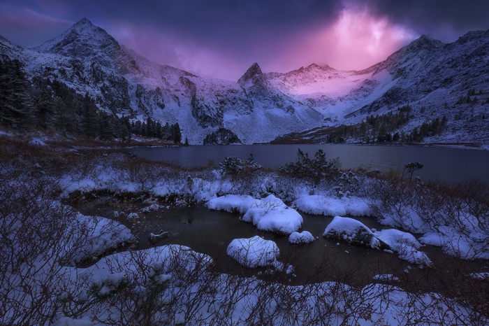 Snowy Mountains and Lake in Russia at Sunset