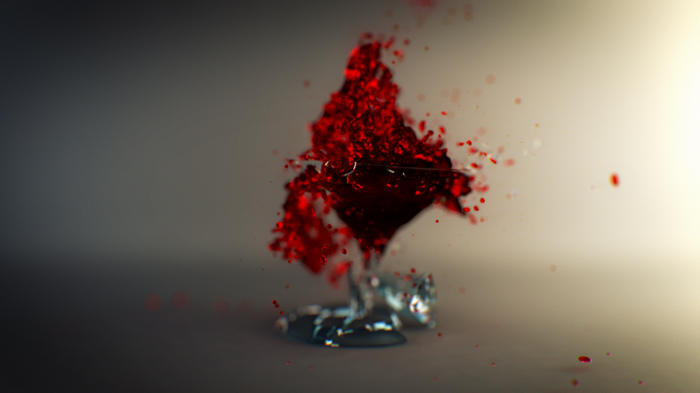Red wine shattering from a glass
