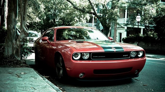 Red Dodge Challenger SRT parked on a street