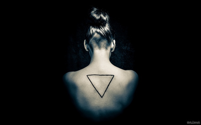 Woman with triangle tattoo on back
