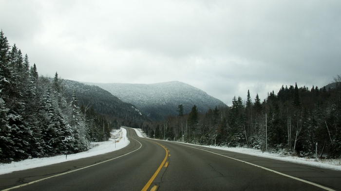 Winding road through a snowy mountain landscape