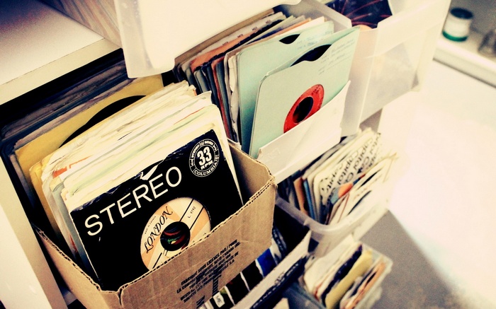 Stack of vinyl records in storage boxes