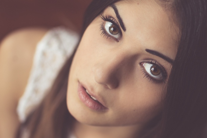Close-up of a woman with brown eyes