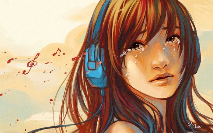 Girl with headphones crying to music