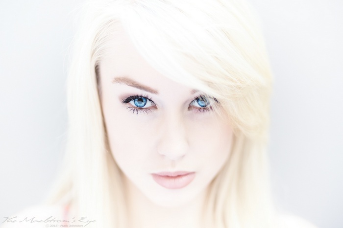 Close-up of a blonde woman with blue eyes