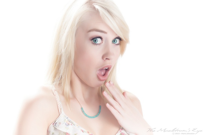 Woman with blonde hair and green eyes