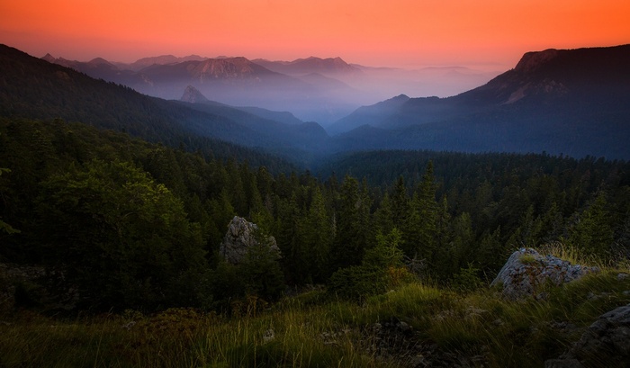 Misty mountains and forest at sunset in Bosnia