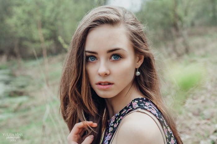 Portrait of a young woman with blue eyes
