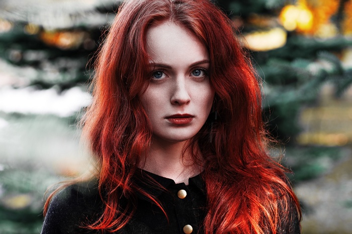 Portrait of a young woman with red hair