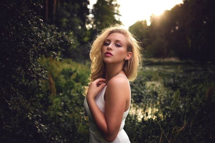 Woman in white dress in a forest
