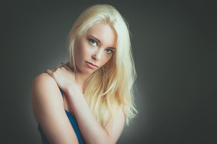 Blonde woman with blue top