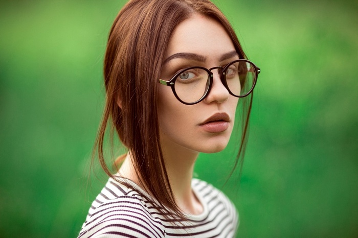 Woman with glasses and striped shirt