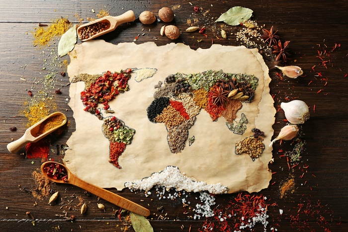 World map made of spices on parchment