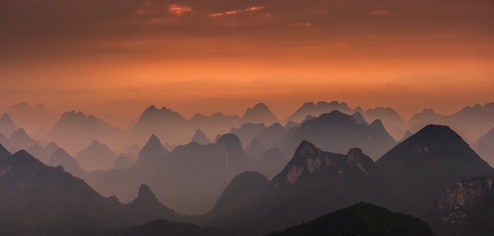 Misty Mountains in Guilin, China at Sunset