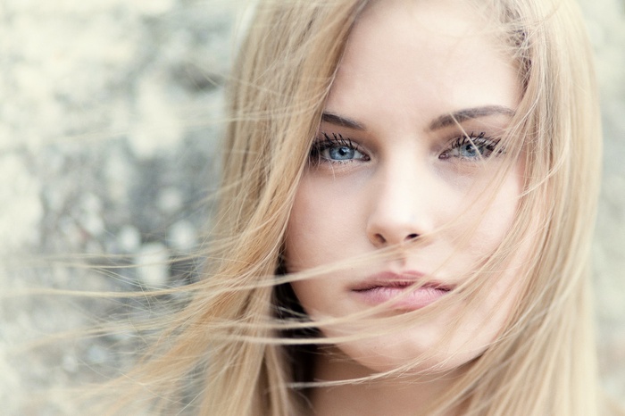 Close-up of a blonde woman with blue eyes