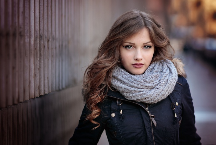 Portrait of a young woman with a scarf