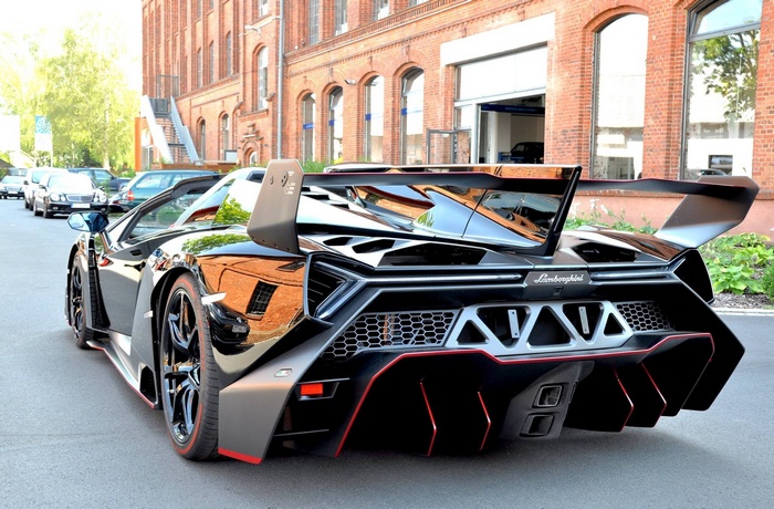 Black Lamborghini Veneno parked on a street