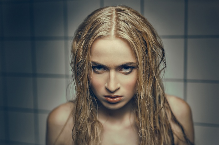 Portrait of a blonde woman with wet hair