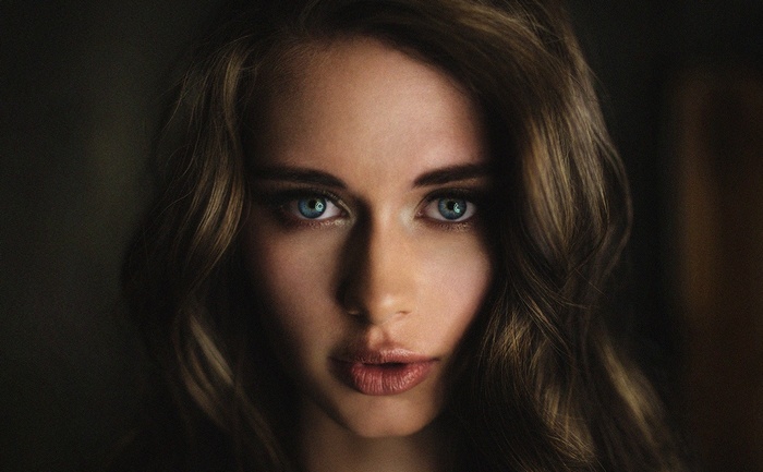 Woman with striking blue eyes looking at viewer