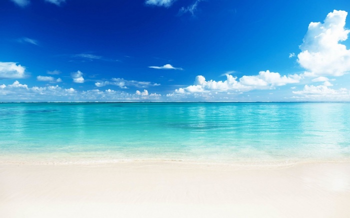 Tropical beach with turquoise water and blue sky