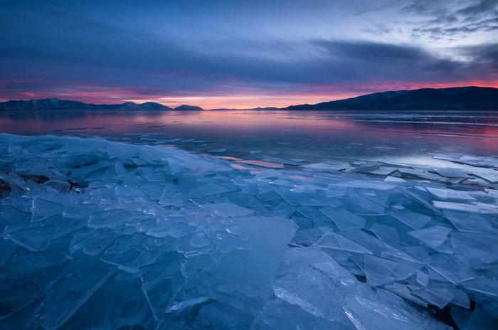 Ice chunks on a lake at sunset